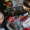 A music CD is among tributes left outside the home of British musician George Michael in London, Monday, Dec. 26, 2016. George Michael, who rocketed to stardom with WHAM! and went on to enjoy a long and celebrated solo career lined with controversies, died Sunday, his publicist said Sunday. Michael  was 53.