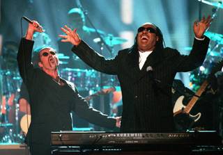 George Michael, left, and Stevie Wonder perform 