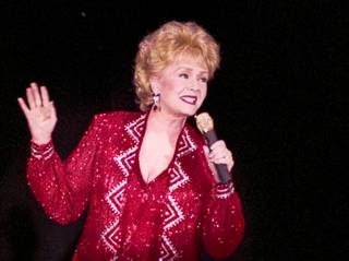 Debbie Reynolds performs during her 56th birthday celebration April 1, 1997, in Las Vegas. CREDIT: Brian Jones/Las Vegas News Bureau