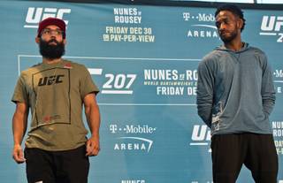 UFC welterweight fighter Johny Hendricks stands with Neil Magny following a face off for UFC 207 Media Day at the T-Mobile Arena on Wednesday, Dec. 28, 2016.