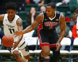 Colorado State guard Prentiss Nixon, left, steals the ball from UNLV guard Uche Ofoegbu during the first half of an NCAA college basketball game Wednesday, Dec. 28, 2016, in Fort Collins, Colo(AP Photo/David Zalubowski)