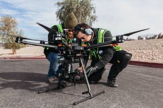 Left, Avisight Equipment Specialist Richard Meeker and Avisight Head of Production Jason Daub setup a drone during a groundbreaking ceremony held at Nevada State College for the HUVR or Henderson Unmanned Vehicle Range on Jan. 4, 2017.
