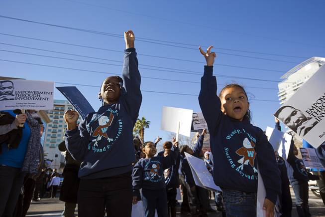 Da'monie Davis, left, and Madeline Obote, kindergarten students from Wendell Williams Elementary School, perform during the 35th annual Dr. Martin Luther King Jr. Day Parade in downtown Las Vegas Monday, Jan. 16, 2017. MGM Resorts International was the presenting sponsor.