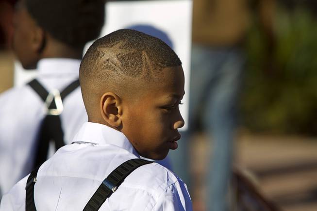 Dterion Bowman, 10, sports a haircut with a star during the 35th annual Dr. Martin Luther King Jr. Day Parade in downtown Las Vegas Monday, Jan. 16, 2017. MGM Resorts International was the presenting sponsor.