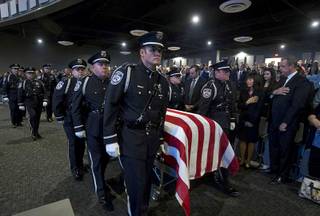 North Las Vegas Police Detective Chad Parque, 32, is carried into the worship hall for a memorial service at Central Christian Church in Henderson Tuesday, Jan. 17, 2017. Parque died from injuries sustained in a Jan. 6 head-on collision while on duty.