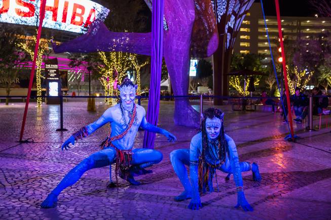 Cast members from Cirque Du Soliel's TORUK- The First Flight interact with tourists during "Party at the Park" in front of the T-Mobile Arena, Tuesday Jan 17, 2017.