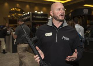 Matt Hunt as a national account manager with Daniel Defense offers his insights on guns and the new presidential administration during the Shot Show at the Sands Expo on Wednesday, Jan. 18, 2017.