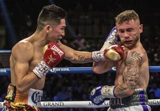 Leo Santa Cruz connects to the chin of Carl Frampton during their world championship rematch of the 2016 Fight of the Year candidate featherweight showdown, a 12-round bout in the co-main event on Saturday, Jan. 28, 2017.