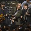 From left, Jeff Lynne, Tom Petty and Dhani Harrison perform "I Won't Back Down" at the MusiCares Person of the Year tribute honoring Tom Petty at the Los Angeles Convention Center on Friday, Feb. 10, 2017. 