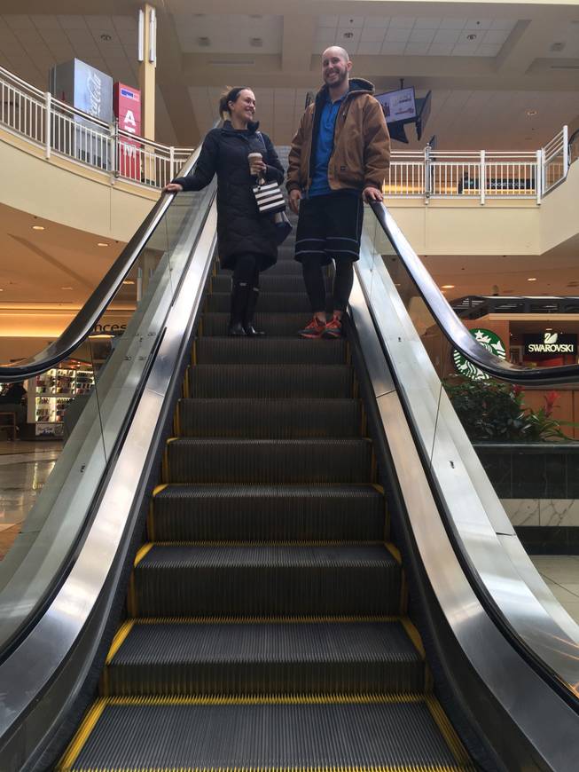 Courtney Taylor, left, and her boyfriend, Zach Tobias, ride the escalator at a mall in Whitehall, Pa., on Feb. 9, 2017. Taylor and Tobias don’t mix shopping with politics but say it seems to be happening more often during the Donald Trump era as activists who either oppose or support the president target stores and brands for boycotts.