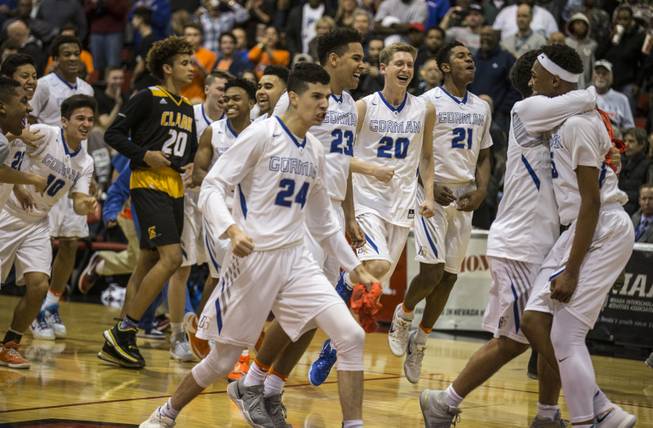 Bishop Gorman players celebrate their win over Clark in the state 4A high school championship game at Cox Pavilion, Friday, Feb. 24, 2017.