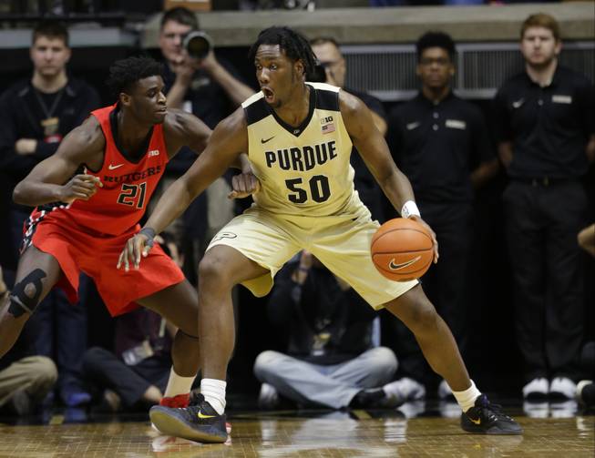 Purdue forward Caleb Swanigan (50) drives on Rutgers forward Candido Sa (21) in the first half of an NCAA college basketball game in West Lafayette, Ind., Tuesday, Feb. 14, 2017.