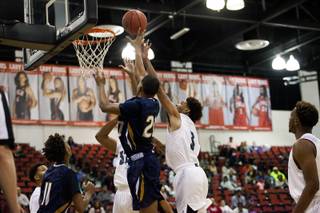 Cheyennes William Federson tries to block Desert Pines' Trevon Abdullahs shot during the high school basketball 3A state title game at Cox Pavilion on Saturday, Feb. 25, 2017.