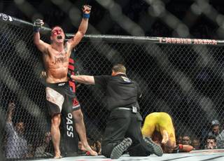 Featherweight fighter Darren Elkins celebrates his defeat of Mirsad Bektic during UFC 209 at the T-Mobile Arena on Saturday, March 4, 2017.
