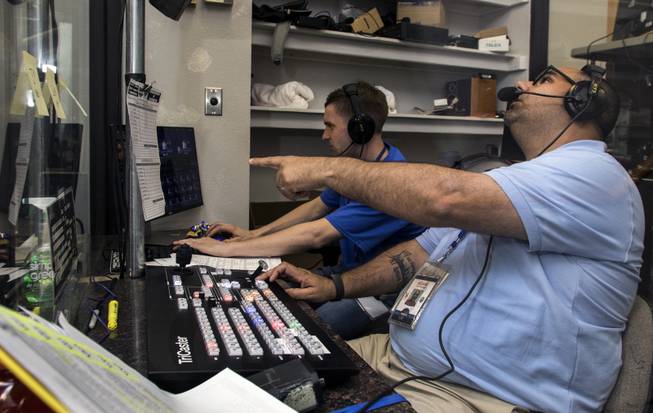 Adam Alberico is the camera director and Charlie Redden (back) the video game operator during the Las Vegas 51s games like here at their home opener versus the Fresno Grizzlies at Cashman Field on Tuesday, April 11, 2017.