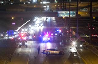 The westbound lanes of I-215 are shut down after an accident involving an unmarked Henderson Police vehicle near Valle Verde Drive in Henderson Thursday, April 20, 2017.