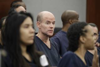 Nicolai Howard Mork, center, appears in court Tuesday, April 25, 2017, in Las Vegas. Mork is accused of terrorism and possession of weapons of mass destruction, explosives and firearms charges.