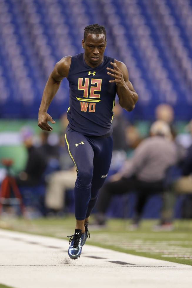 Washington wide receiver John Ross runs the 40-yard dash at the NFL football scouting combine in Indianapolis, Saturday, March 4, 2017.