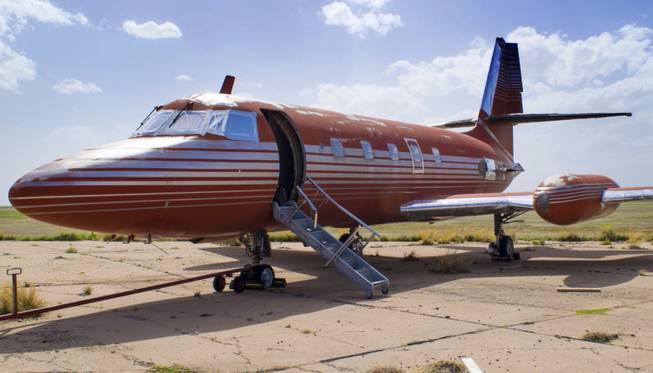 This undated photo provided by GWS Auctions, Inc. shows a private jet once owned by Elvis Presley, on a runway in New Mexico.