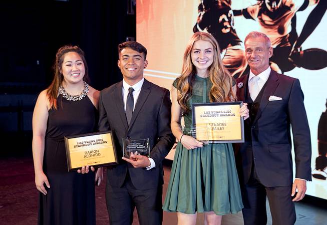 2017 Scholar Athletes Darion Acohido of Liberty High School and Kenadee Bailey of Boulder City High School pose with Kaitlyn Matsubara of Findlay Toyota and Greenspun Media Group's Gordon Prouty during the second annual Las Vegas Sun Standout Awards, an award show recognizing local high school athletes, at the South Point Wednesday, May 24, 2017.