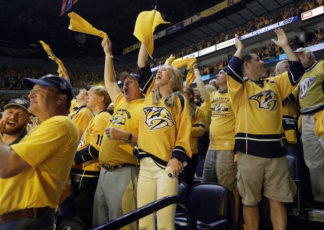 Nashville Predators fans cheer after a goal against the Pittsburgh Penguins during the second period in Game 4 of the NHL hockey Stanley Cup Finals Monday, June 5, 2017, in Nashville, Tenn.
