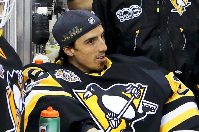 Pittsburgh Penguins goalie Marc-Andre Fleury watches from the bench during the third period of Game 5 in the NHL hockey Stanley Cup Eastern Conference finals against the Ottawa Senators, Sunday, May 21, 2017, in Pittsburgh. 