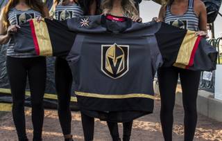 The Golden Knights show off their new uniforms to the fans gathered at the Welcome To Las Vegas sign on Tuesday, June 16, 2017.