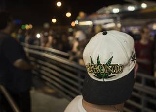 Many customers waiting in a long line at Reef Dispensaries wear weed-related items as recreational sales of marijuana begin at Midnight in Nevada and dispensaries across Las Vegas are open too on Friday, June 30, 2017.