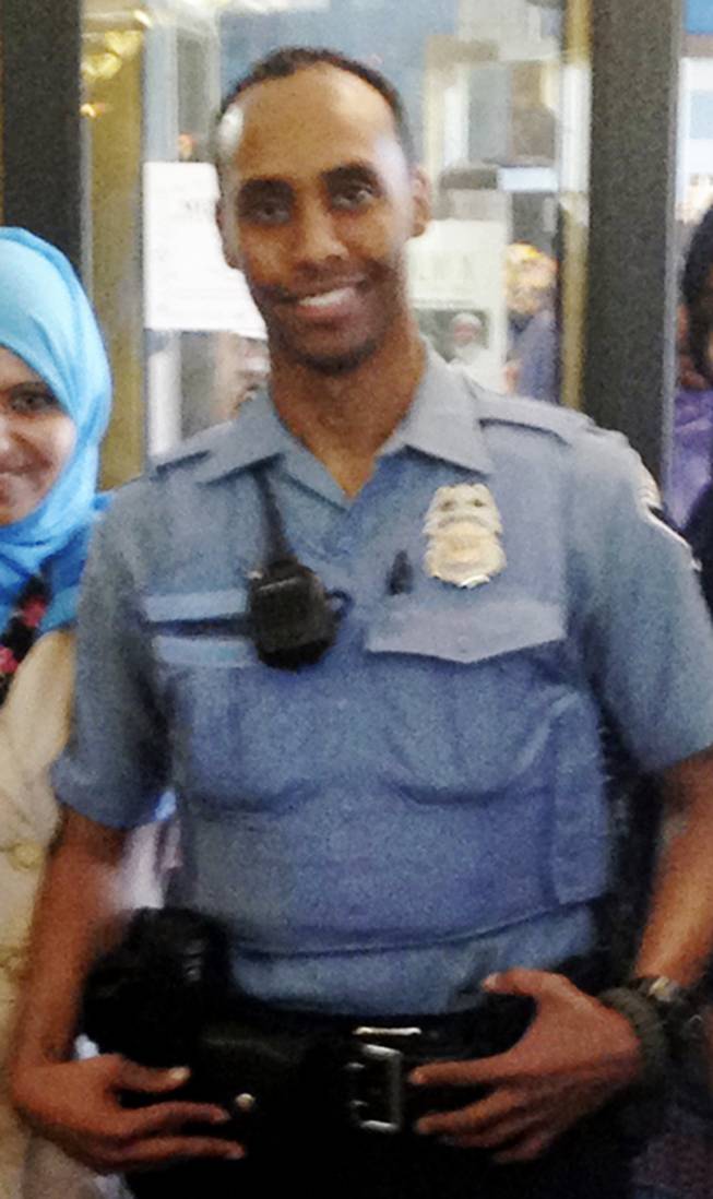 In this May 2016 image provided by the City of Minneapolis, police Officer Mohamed Noor poses for a photo at a community event welcoming him to the Minneapolis police force. Noor, a Somali-American, has been identified by his attorney as the officer who fatally shot Justine Damond, of Australia, late Saturday, July 15, 2017, after she called 911 to report what she believed to be an active sexual assault.