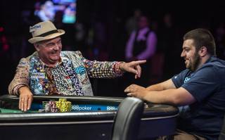 WSOP players John Hesp and Scott Blumstein joke around during the first of three straight nights to finish poker's world championship as the table goes from 9 to 6 players at the Rio on Thursday, July 20, 2017.