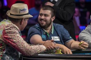 Scott Blumstein smiles at his fans after winning a pot during the second of three straight nights to finish poker's world championship as the table goes from 7 to 3 players at the Rio on Friday, July 21, 2017.