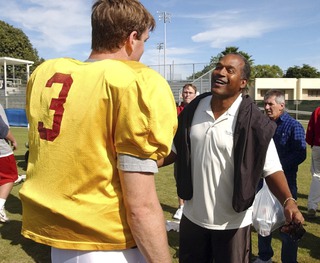 In this Dec. 28, 2002, file photo, University of Southern California quarterback Carson Palmer talks to O.J. Simpson after practice for the Orange Bowl in Davie, Fla.