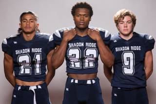 Members of the Shadow Ridge High School football team, from left, Kaejin Smith, Aubrey Nellems and Chase Harlaher pose for a portrait at the Las Vegas Sun's high school football media day August 2, 2017, at the South Point.