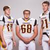 Members of the Pahrump Valley High School football team, from left, Dylan Coffman, Justin Soliwoda and Cory Bergan pose for a portrait at the Las Vegas Sun's high school football media day August 2, 2017, at the South Point.