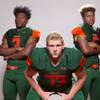 Members of the Mojave High School football team, from left, Tawee Walker, Dylan Mleynek and Xavier Delong pose for a portrait at the Las Vegas Sun's high school football media day August 2, 2017, at the South Point.