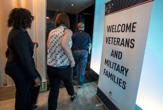 Attendees arrive at a penthouse gathering as the Cosmopolitan hosts another Supporting Our Veterans Career Fair on Wednesday, August 23, 2017.
