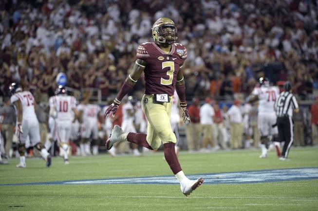 In this Sept. 6, 2016, file photo, Florida State defensive back Derwin James (3) celebrates after an interception by defensive back Tarvarus McFadden during the second half of an NCAA college football game against Mississippi in Orlando, Fla. James is one of the players to keep an eye on when ACC schools begin preseason camp over the summer.