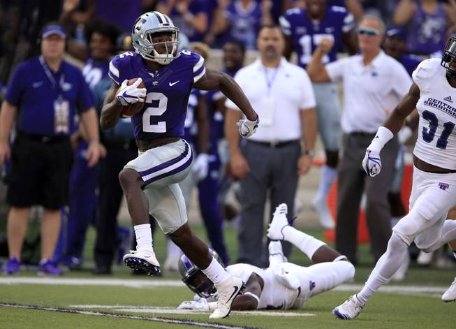 Kansas State return specialist D.J. Reed (2) dodges a tackle by Central Arkansas' Lester Wells (17) for a 96-yard kickoff return during the first half of an NCAA college football game in Manhattan, Kan., Saturday, Sept. 2, 2017. Reed was finally tackled on the four-yard-line. 