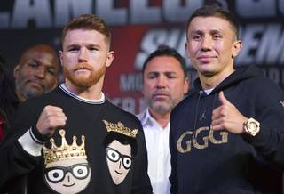 Middleweight boxer Canelo Alvarez, left, of Mexico and WBC/WBA/IBF middleweight champion Grennady Golovkin of Kazakhstan pose during a news conference at MGM Grand Wednesday, Sept. 13, 2017.