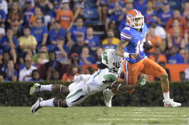 Florida wide receiver Freddie Swain (16) is tackled by North Texas defensive back Ashton Preston (27) after catching a pass during the second half of an NCAA college football game in Gainesville, Fla., Saturday, Sept. 17, 2016. 