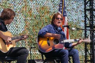 John Fogerty and his son perform a couple songs during a groundbreaking ceremony for a new Crisis Intervention Center and Public Memorial at Veterans Village #2 in Downtown Las Vegas on September 28, 2017.