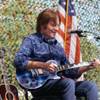 John Fogerty and his son perform a couple songs during a groundbreaking ceremony for a new crisis intervention center and memorial at Veterans Village east of downtown Las Vegas on Sept. 28, 2017.
