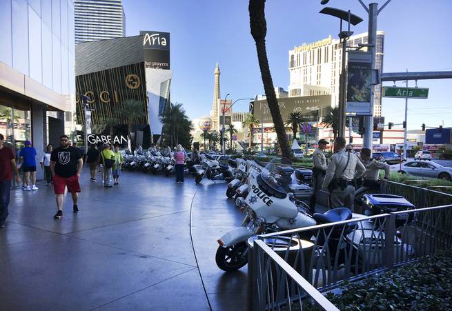 Metro Police lines the sidewalk in front of City Center on the Las Vegas Strip following a mass shooting which left 58 people dead and over 500 injured, Monday, Oct. 2, 2017.