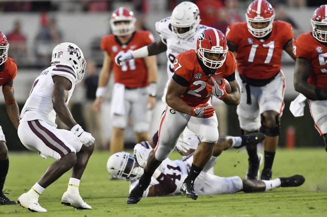 Georgia running back Nick Chubb (27) runs against Mississippi State during the first of an NCAA college football game, Saturday, Sept. 23, 2017, in Athens, Ga. 