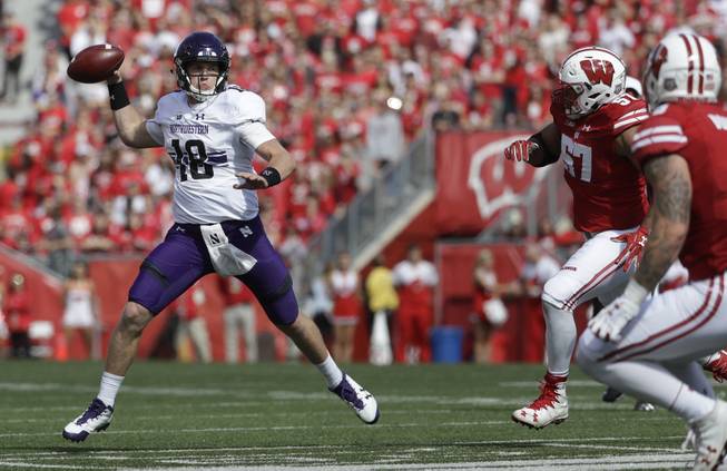 Northwestern's Clayton Thorson throws during the first half of an NCAA college football game against Wisconsin Saturday, Sept. 30, 2017, in Madison, Wis. 
