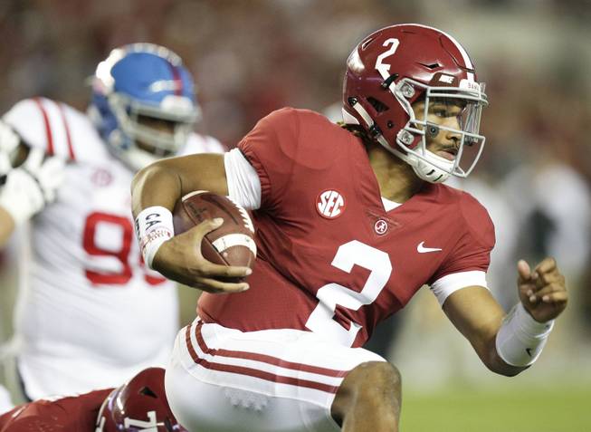 Alabama quarterback Jalen Hurts runs the ball against Mississippi during the first half of an NCAA college football game, Saturday, Sept. 30, 2017, in Tuscaloosa, Ala. 