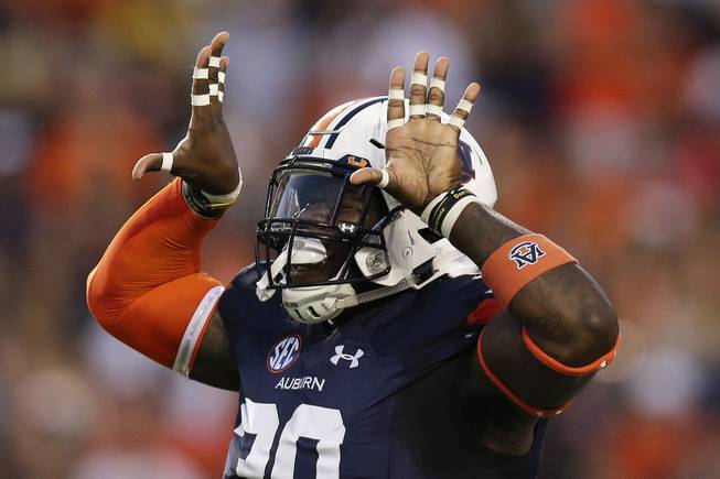 Auburn linebacker Tre' Williams celebrates after a tackle against Georgia Southern in the first half of an NCAA college football game, Saturday, Sept. 2, 2017, in Auburn, Ala. 