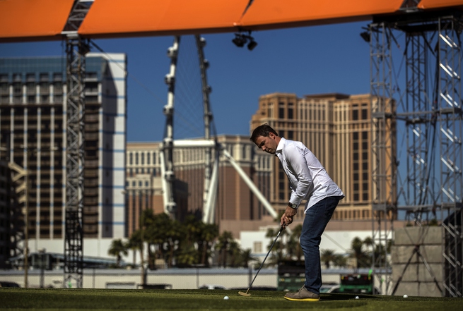Guiilaume Beland as president and general manager with the Major Series Of Putting sinks a few putts as the stadium course is nearly done and ready for play located behind Planet Hollywood Wednesday, Oct. 11, 2017.  L.E. Baskow.