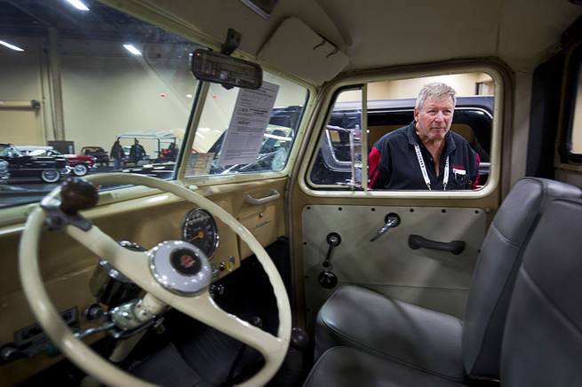 John Schwichtenberg of Joliet, Mont. looks into the cab of a rare 1955 Willys Jeep 4X4 pickup truck before the 10th annual Barrett-Jackson Las Vegas classic car auction at the Mandalay Bay Convention Center Wednesday, Oct. 18, 2017. The three-day auction begins Thursday.