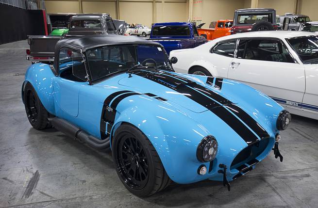 A 1965 Shelby Cobra re-creation roadster built by Cobra expert Bill Jordan is displayed before the 10th annual Barrett-Jackson Las Vegas classic car auction at the Mandalay Bay Convention Center Wednesday, Oct. 18, 2017. Proceeds from the sale will support Convoy of Hope, a charity involved in hurricane relief and rebuilding efforts in Texas and Florida.